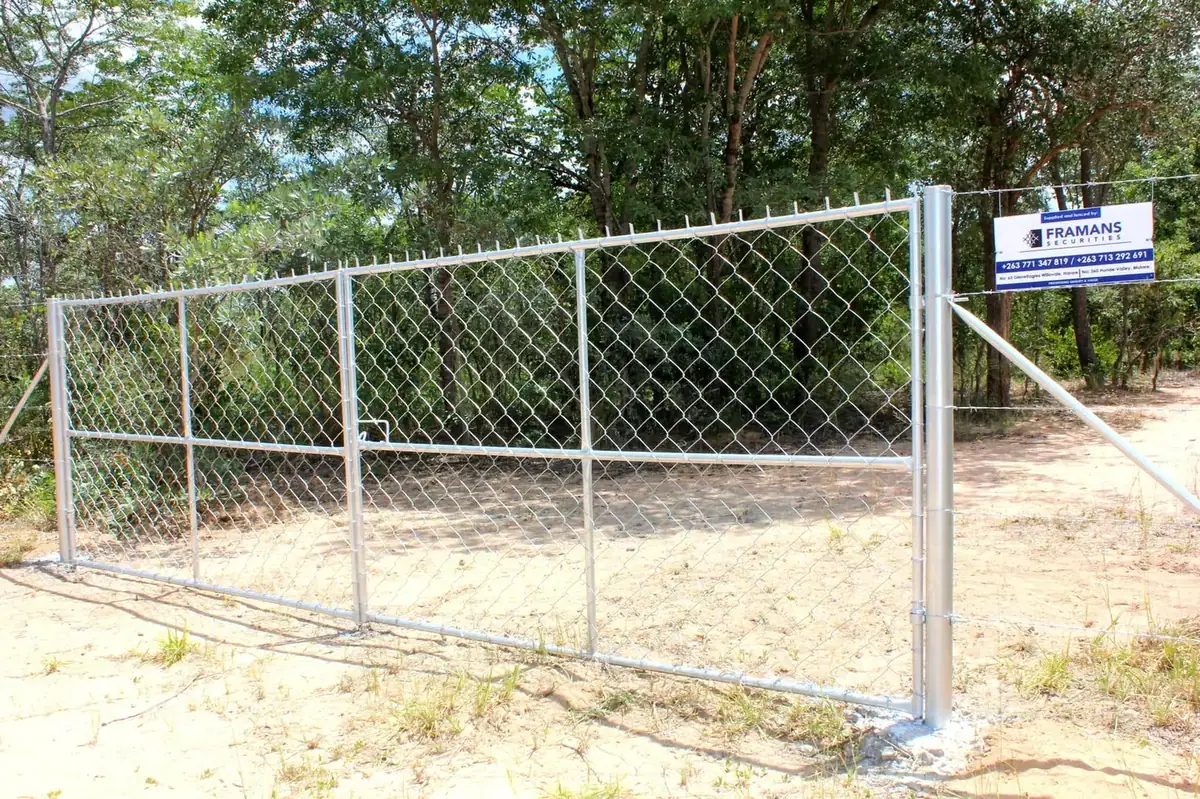 Steel security entrance gate and diamond mesh perimeter fencing installed by Framans